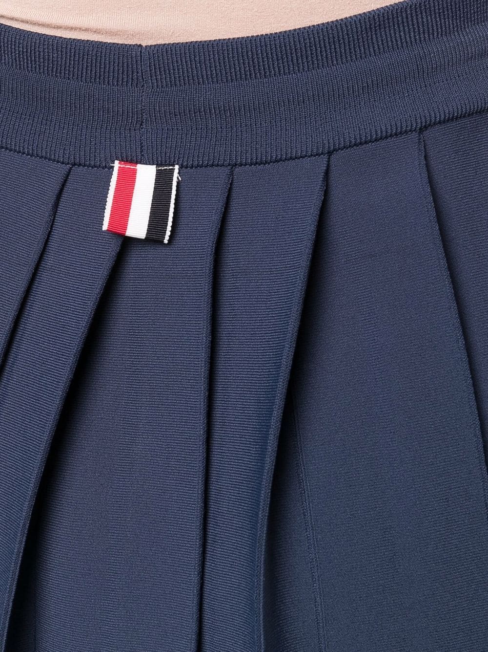 MINI DROPPED BACK PLEATED SKIRT