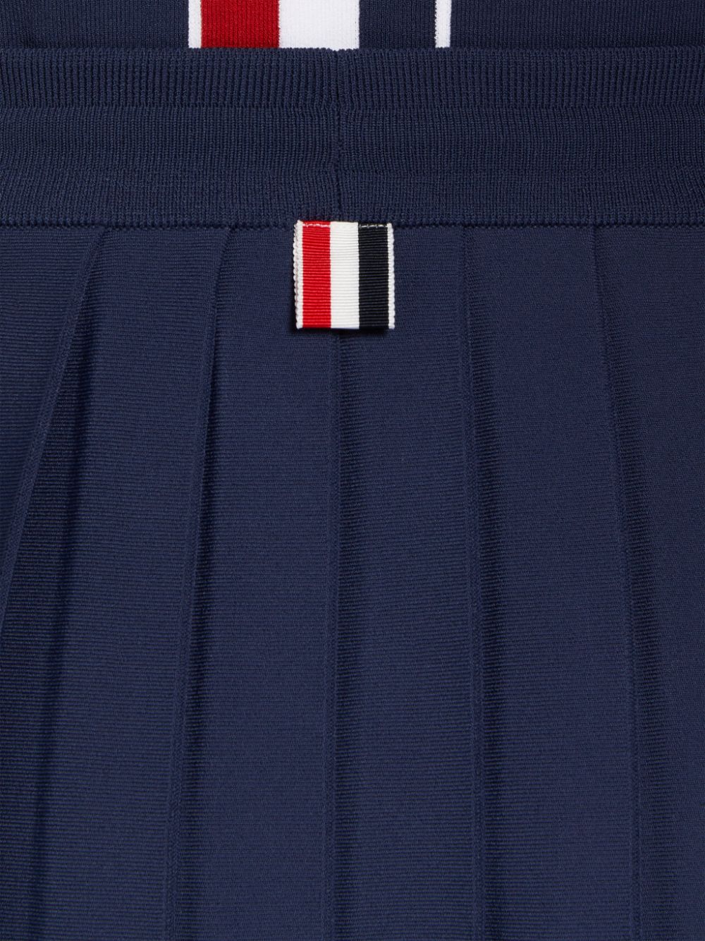 MINI DROPPED BACK PLEATED SKIRT