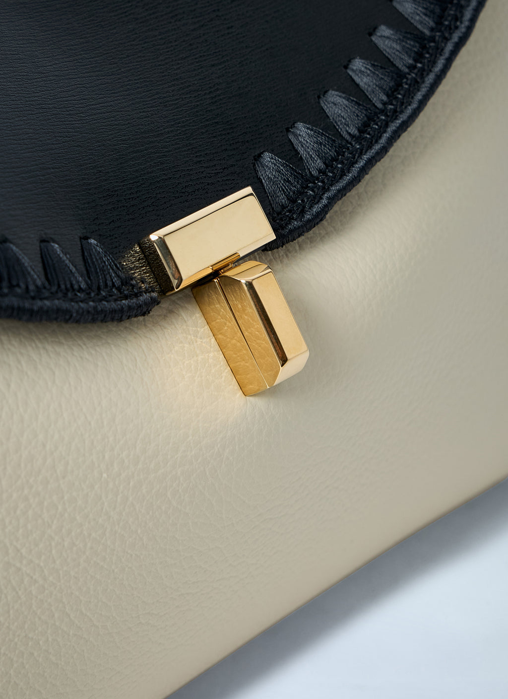 T-Lock Embroidered Leather Clutch Bag